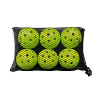 Six chartreuse perforated balls packed inside a black mesh drawstring bag.