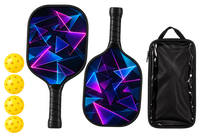 Two black pickleball paddles printed with neon magenta and blue triangles, shown with four yellow balls and a black zippered carry case.
